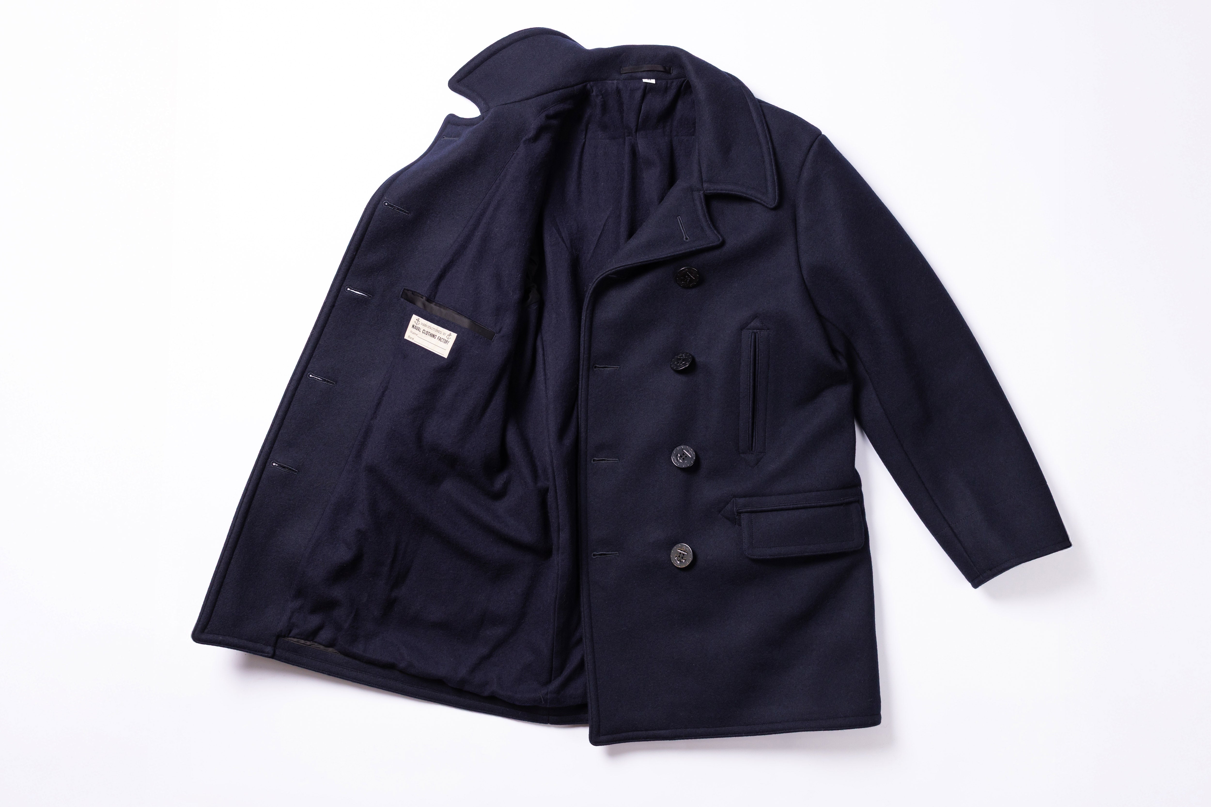Navy blue coat on a white background