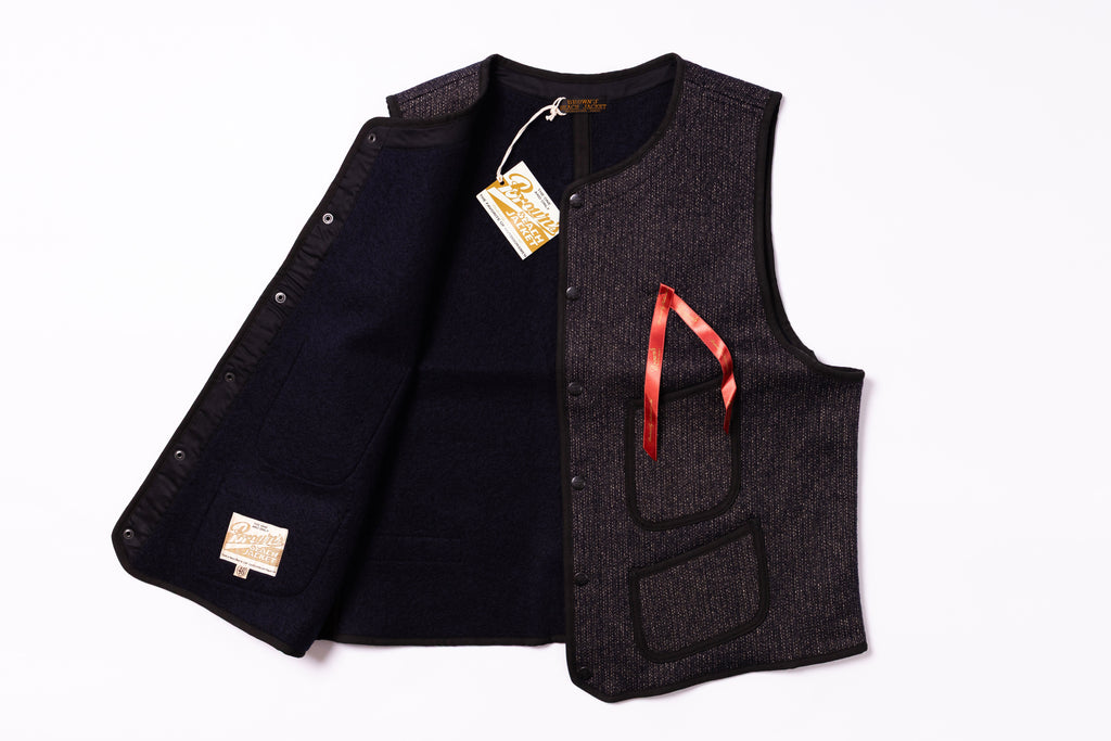 Black vest with a red ribbon on a white background