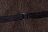 Black belt with a silver buckle on a textured brown background
