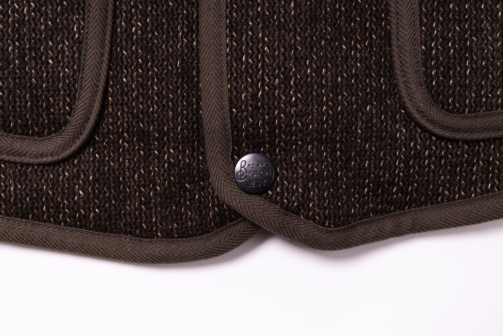 Close-up of a brown textured product with a brand logo on a white background