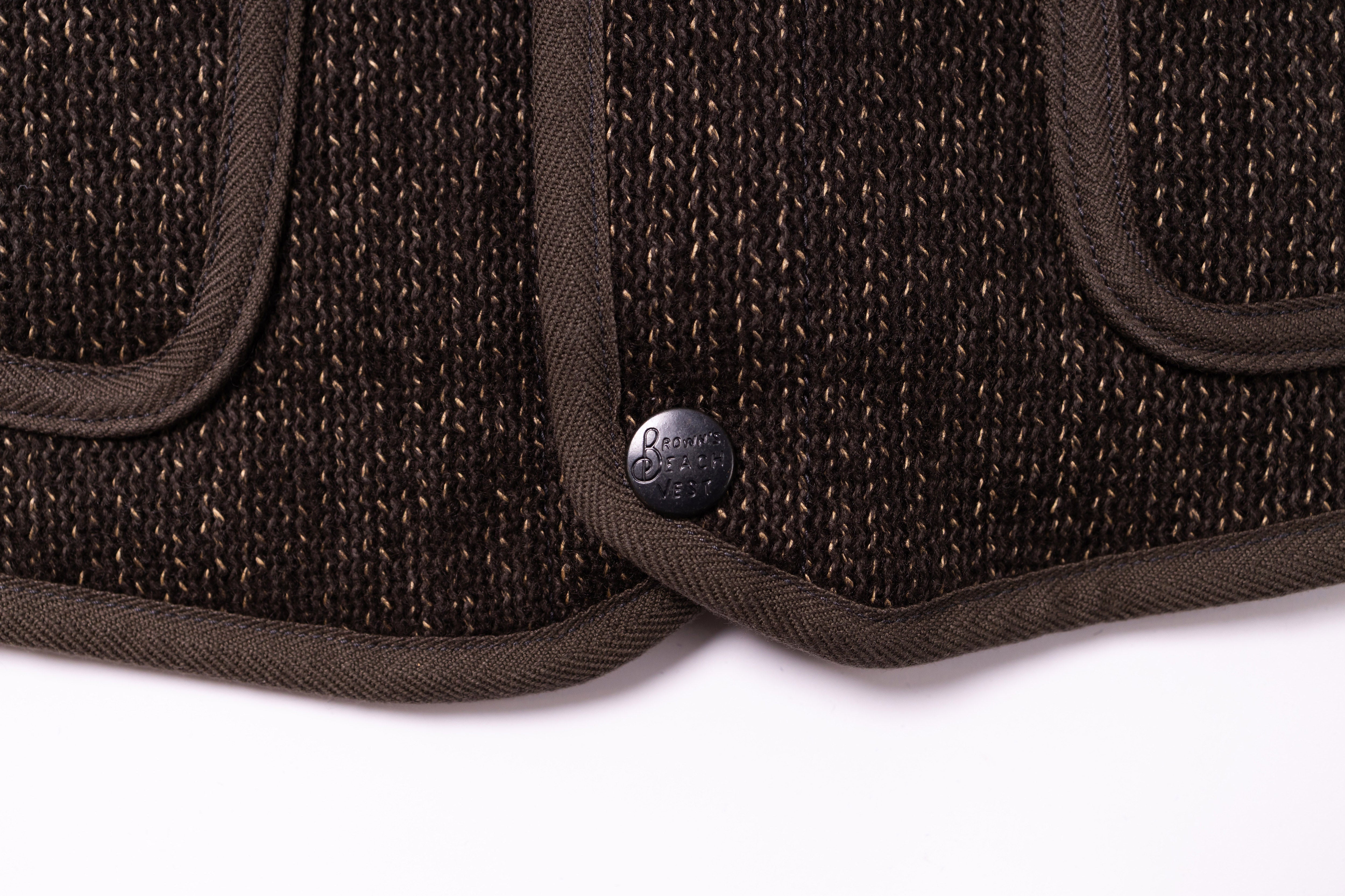 Close-up of a brown textured product with a brand logo on a white background