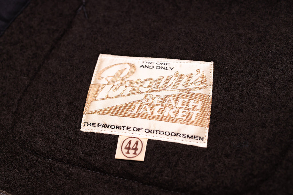 Label on a black jacket with 'Brown's Beach Jacket' text