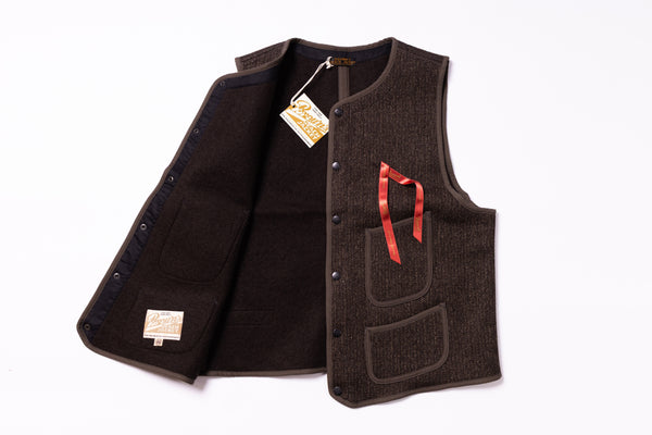Brown vest with a red ribbon on a white background