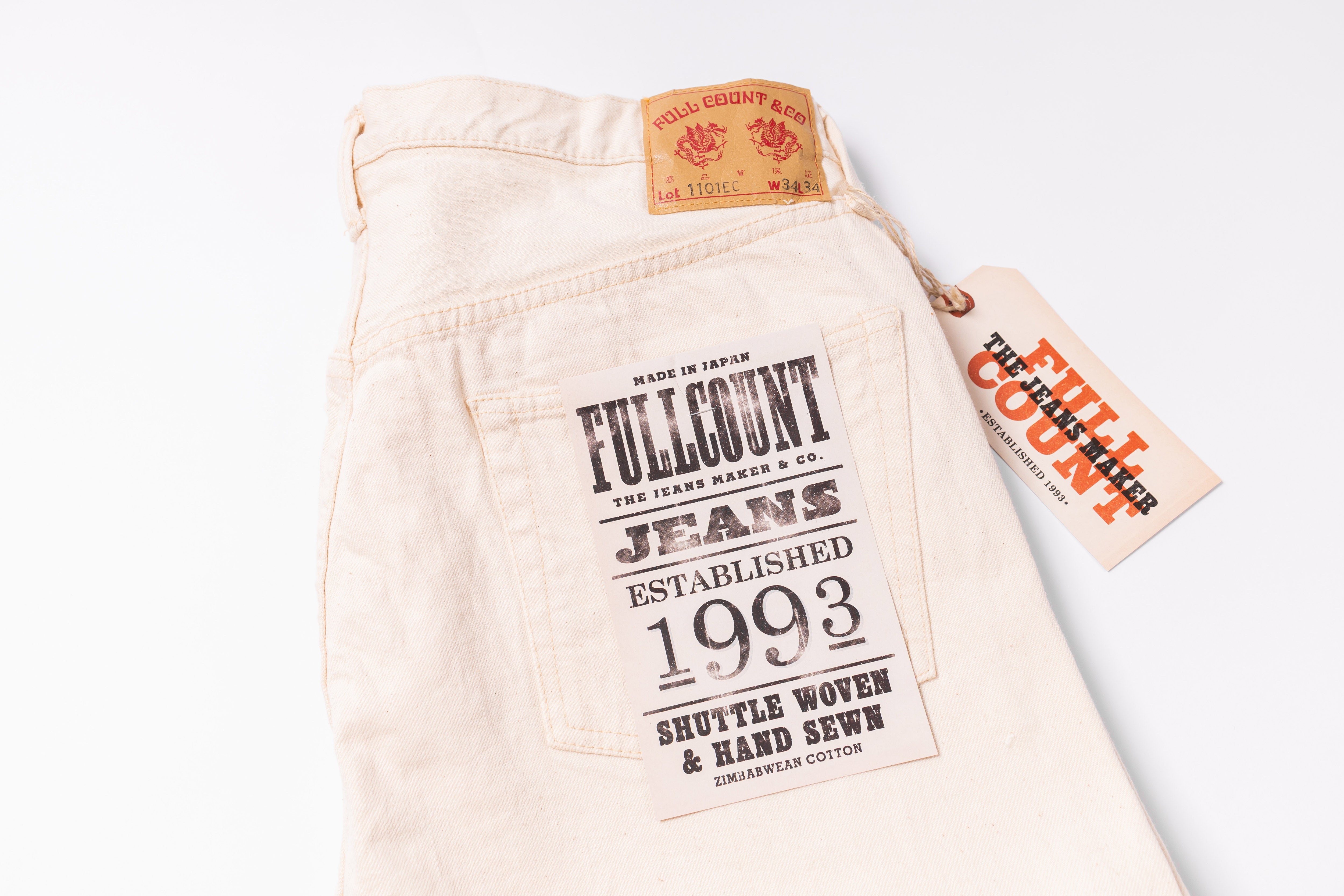 Beige jeans with Fullcount label on a white background