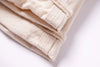 Folded beige towel on a white background