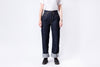 Person wearing dark blue jeans and a white shirt on a white background