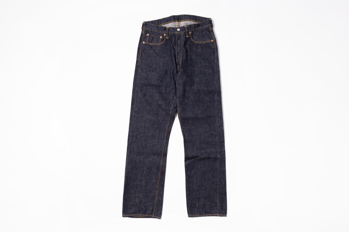 Pair of dark blue jeans on a white background
