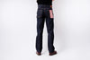 Person wearing dark blue jeans on a white background