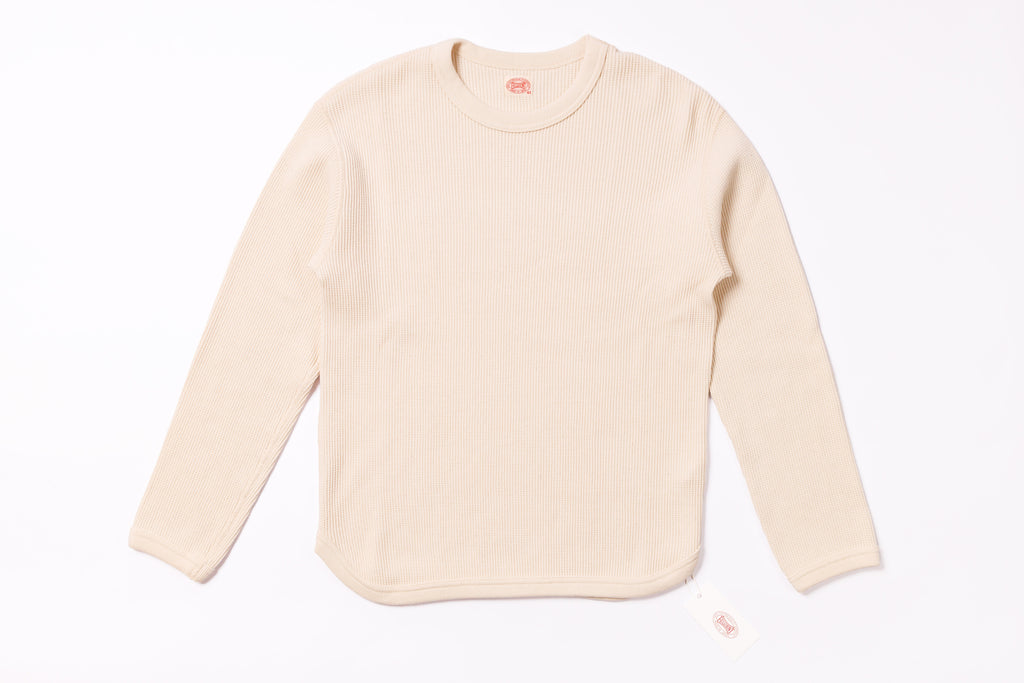 Beige long-sleeve shirt on a white background