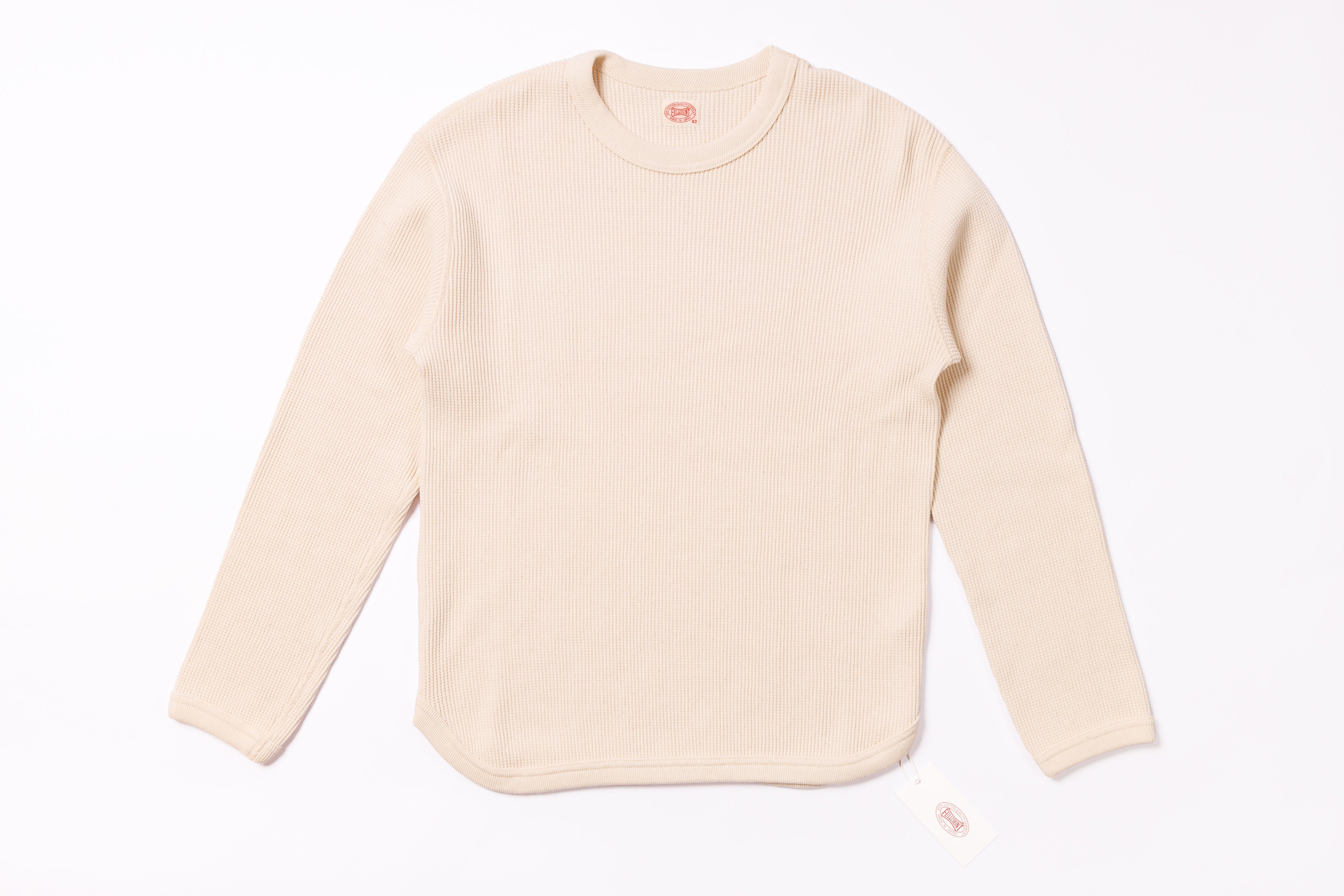 Beige long-sleeve shirt on a white background