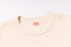 Beige sweater with a brand logo on a white background