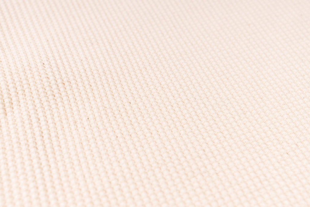 Close-up of beige fabric texture