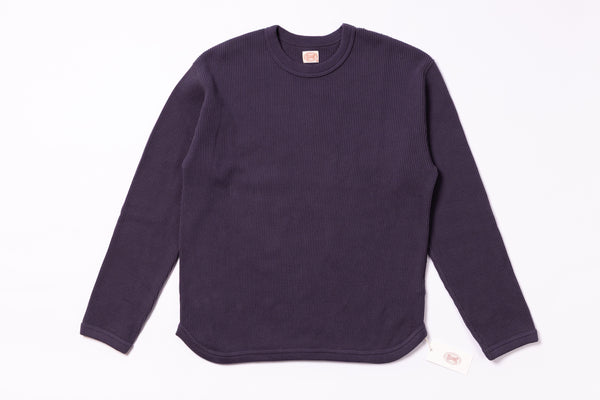 Purple sweater on a white background