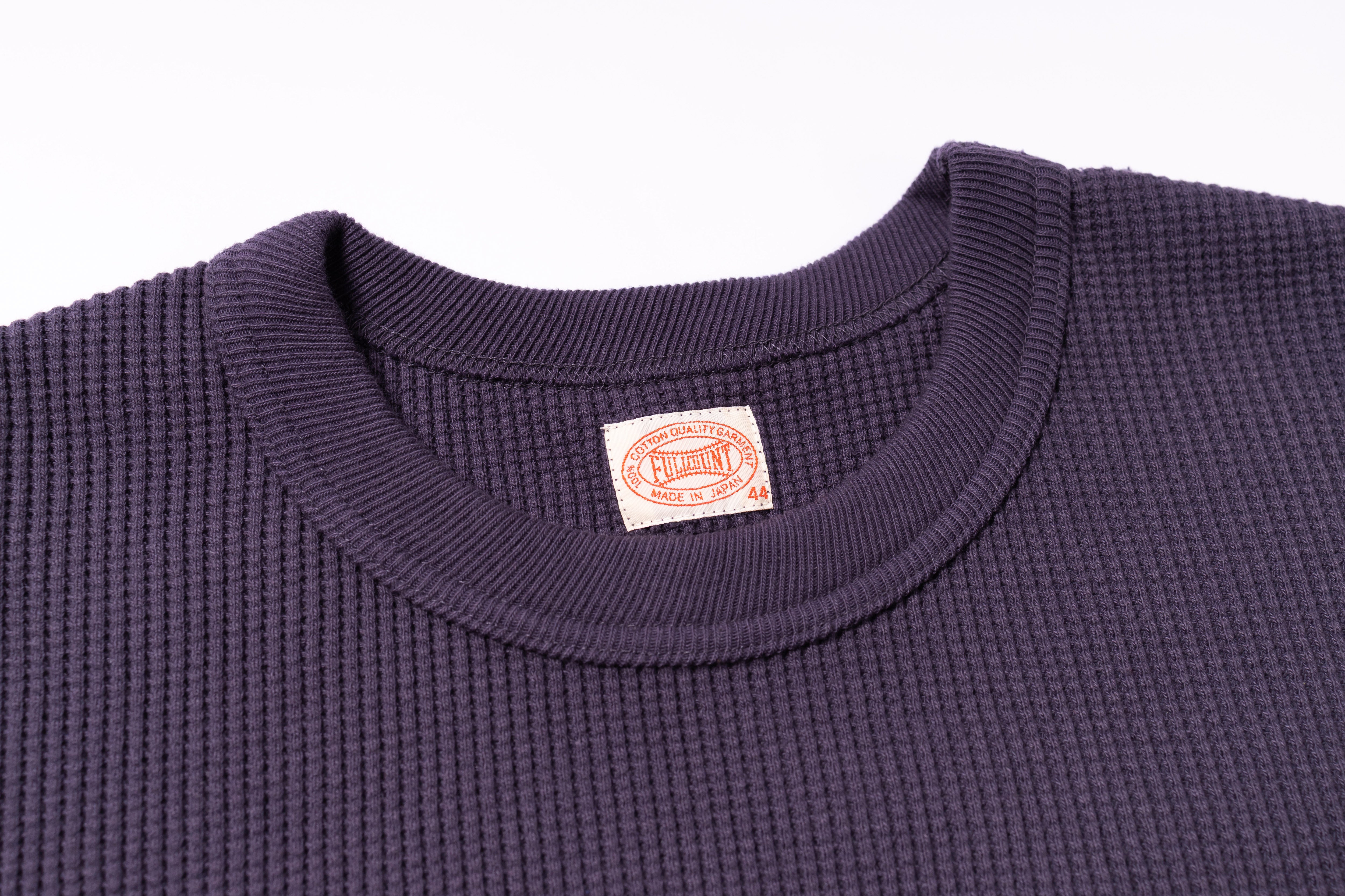 Navy blue textured shirt with a visible brand label on a white background