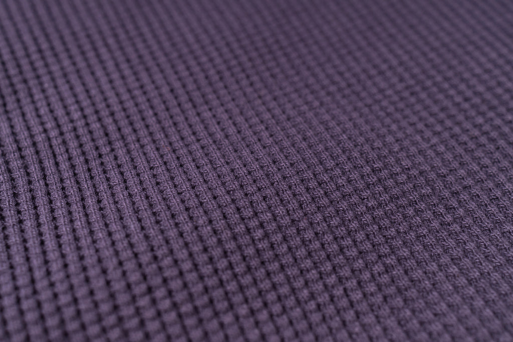 Close-up of purple textured fabric