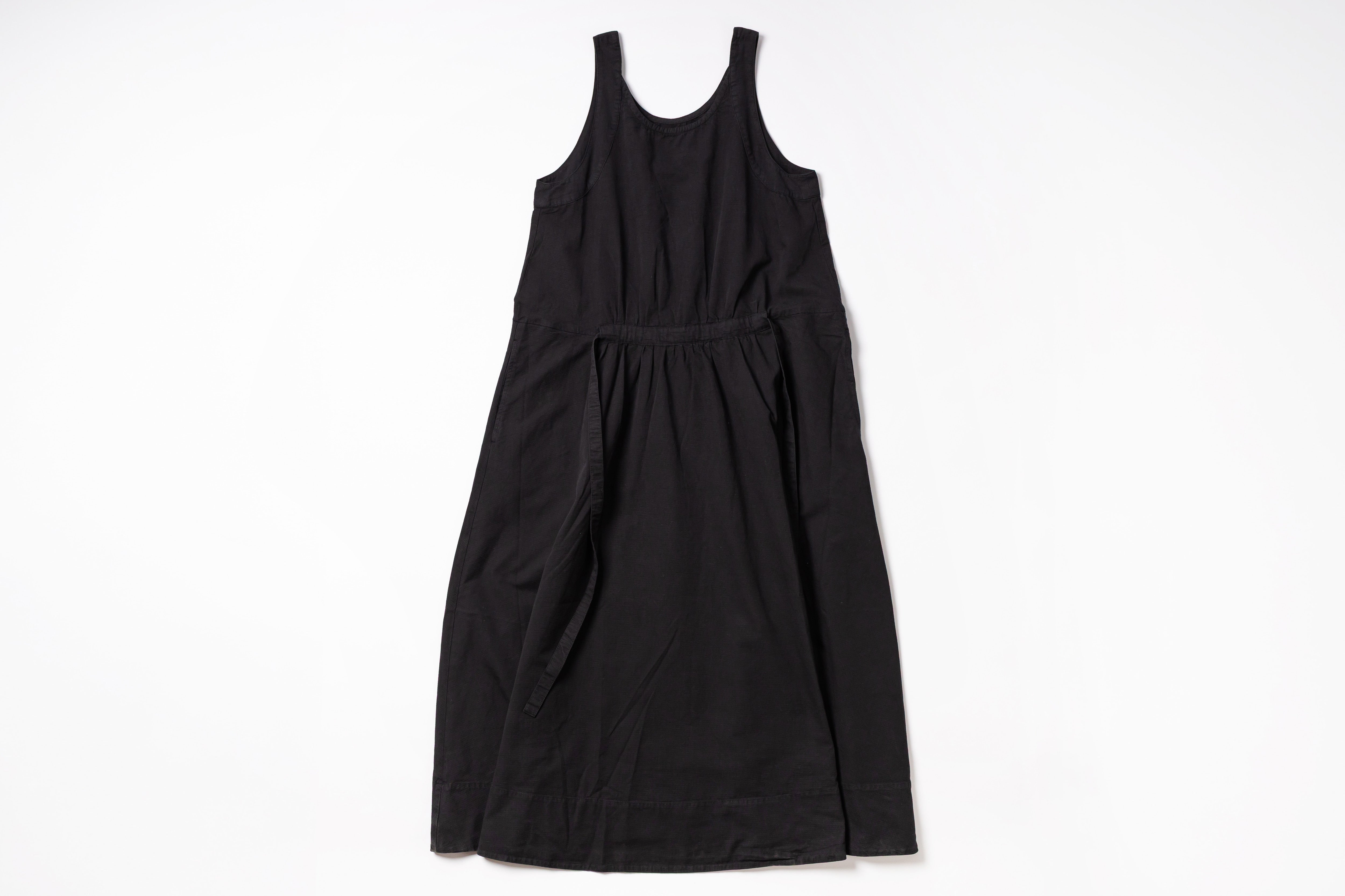 Black sleeveless dress on a white background