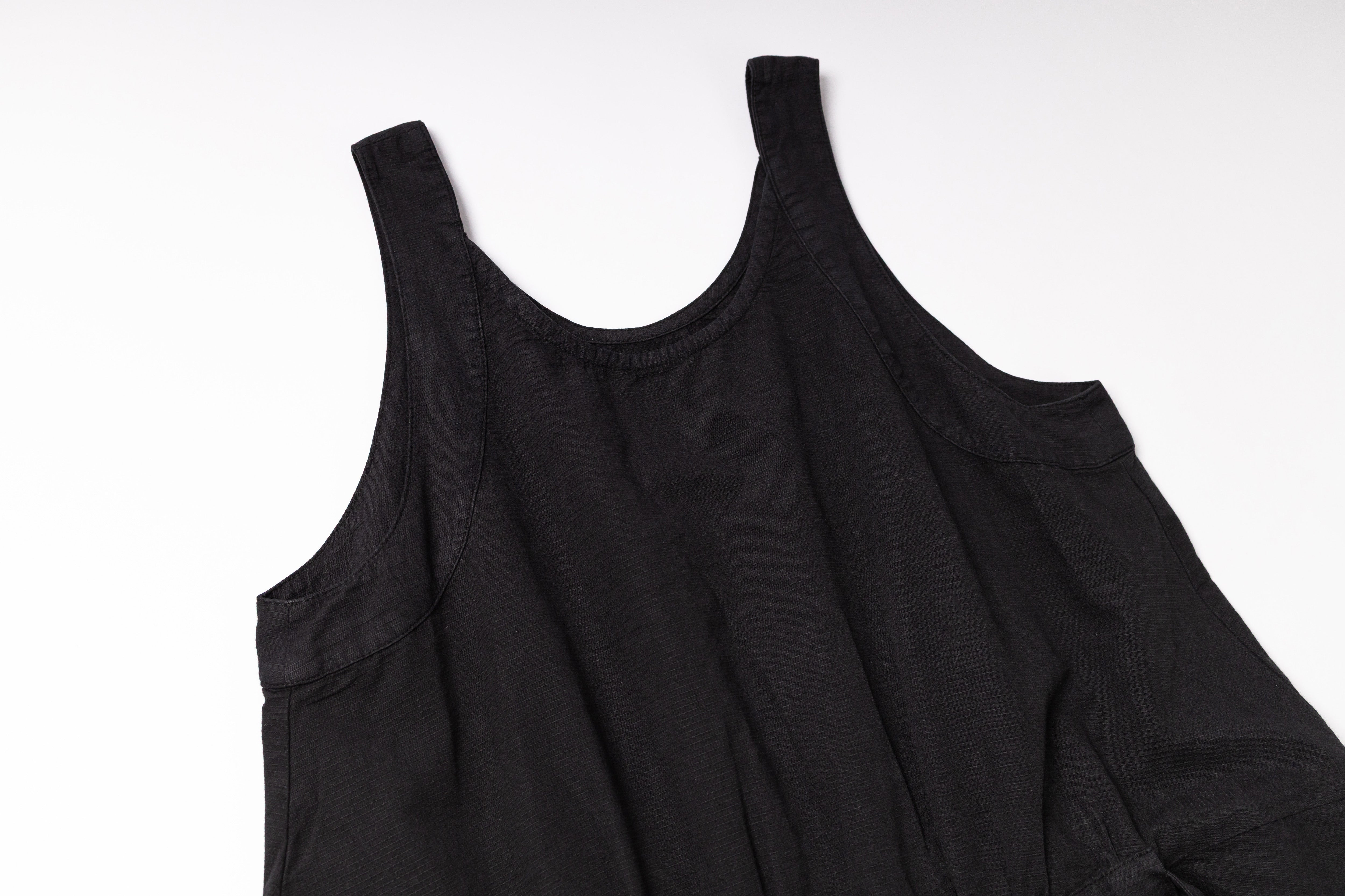 Black sleeveless top on a white background