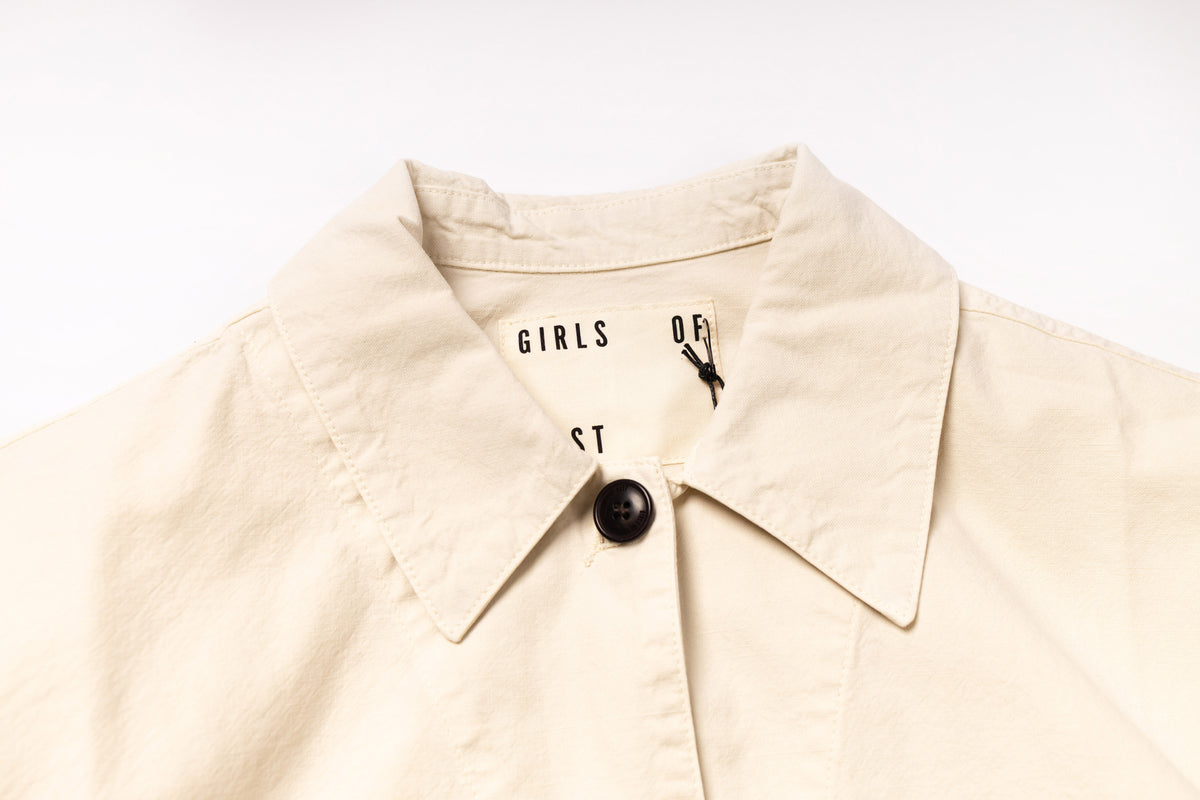 Beige jacket with a brand logo on a white background