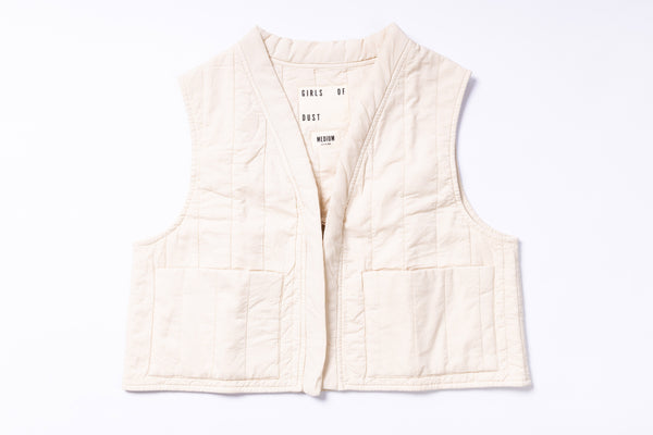 White quilted vest with text on a white background