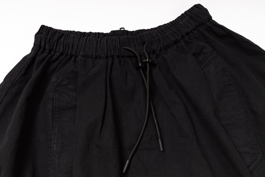 Black pants with drawstring waist on a white background
