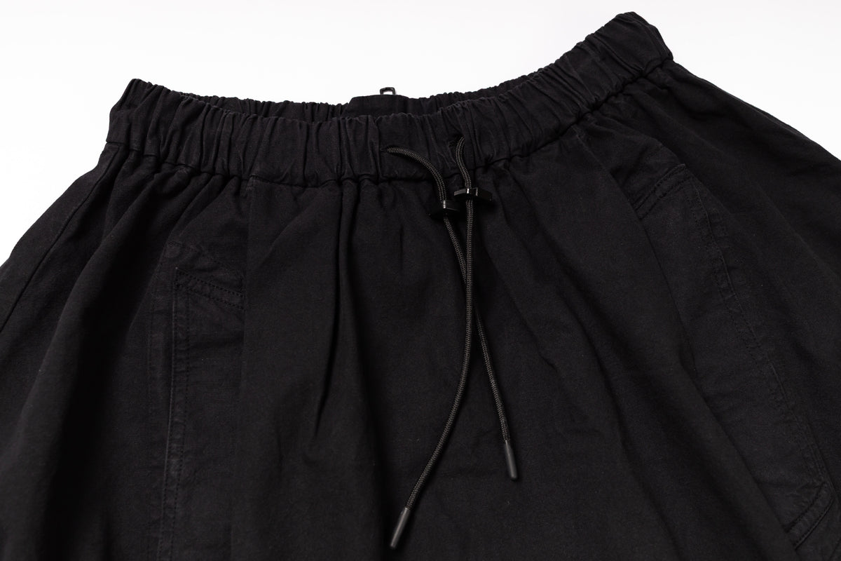 Black pants with drawstring waist on a white background