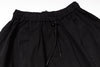 Black pants with drawstring waist on a white background