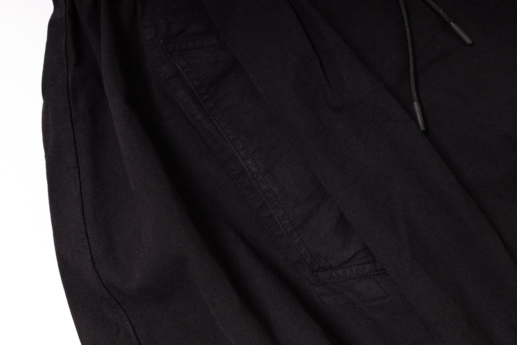 Close-up of a black jacket with a pocket on a white background