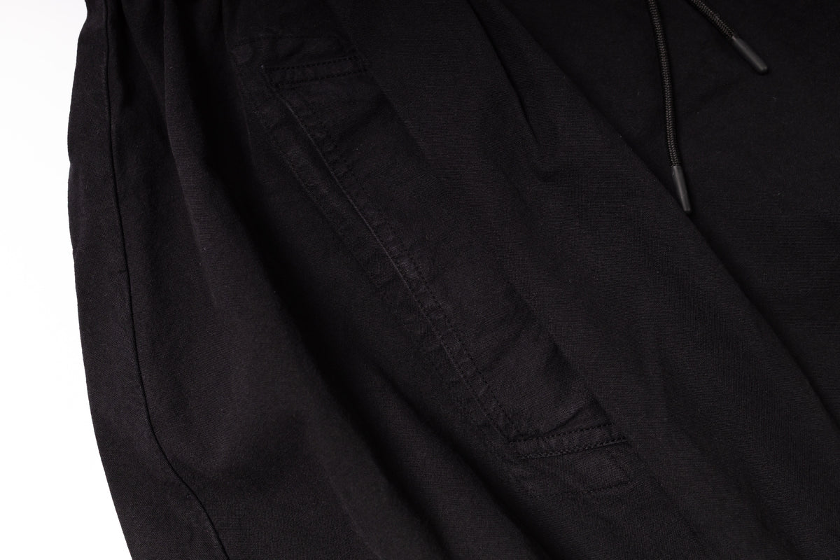 Close-up of a black jacket with a pocket on a white background