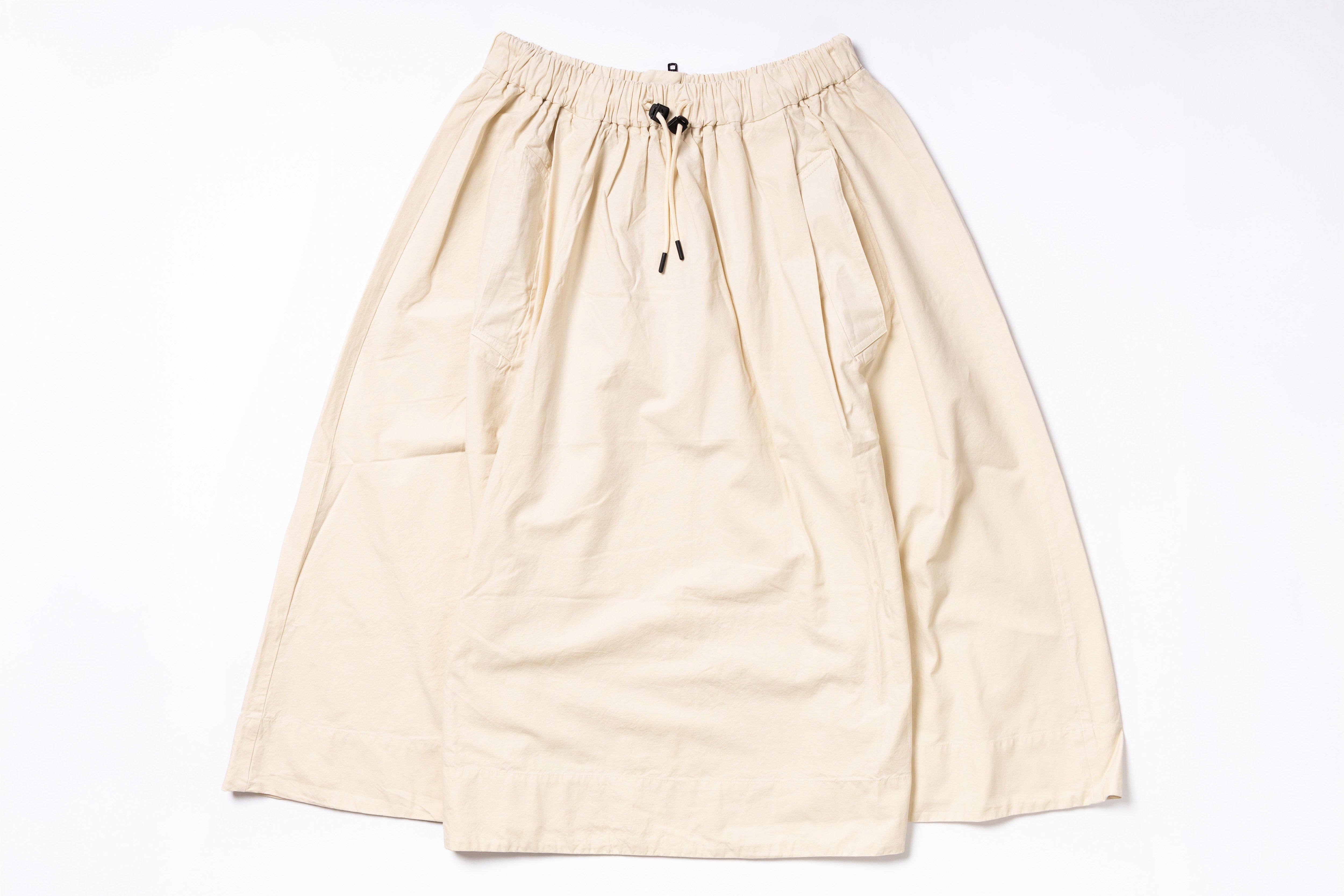 Beige skirt with drawstring on a white background