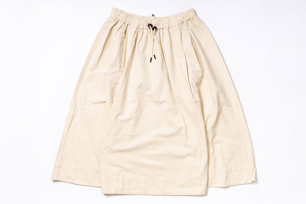 Beige skirt with drawstring on a white background