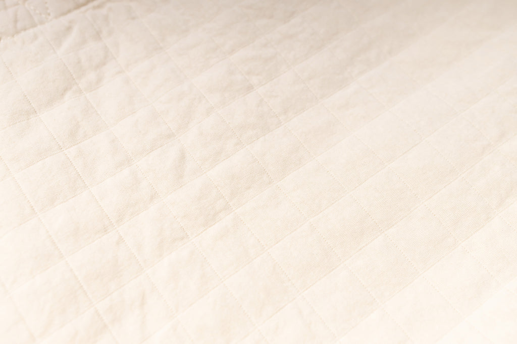 Close-up of a textured beige fabric surface