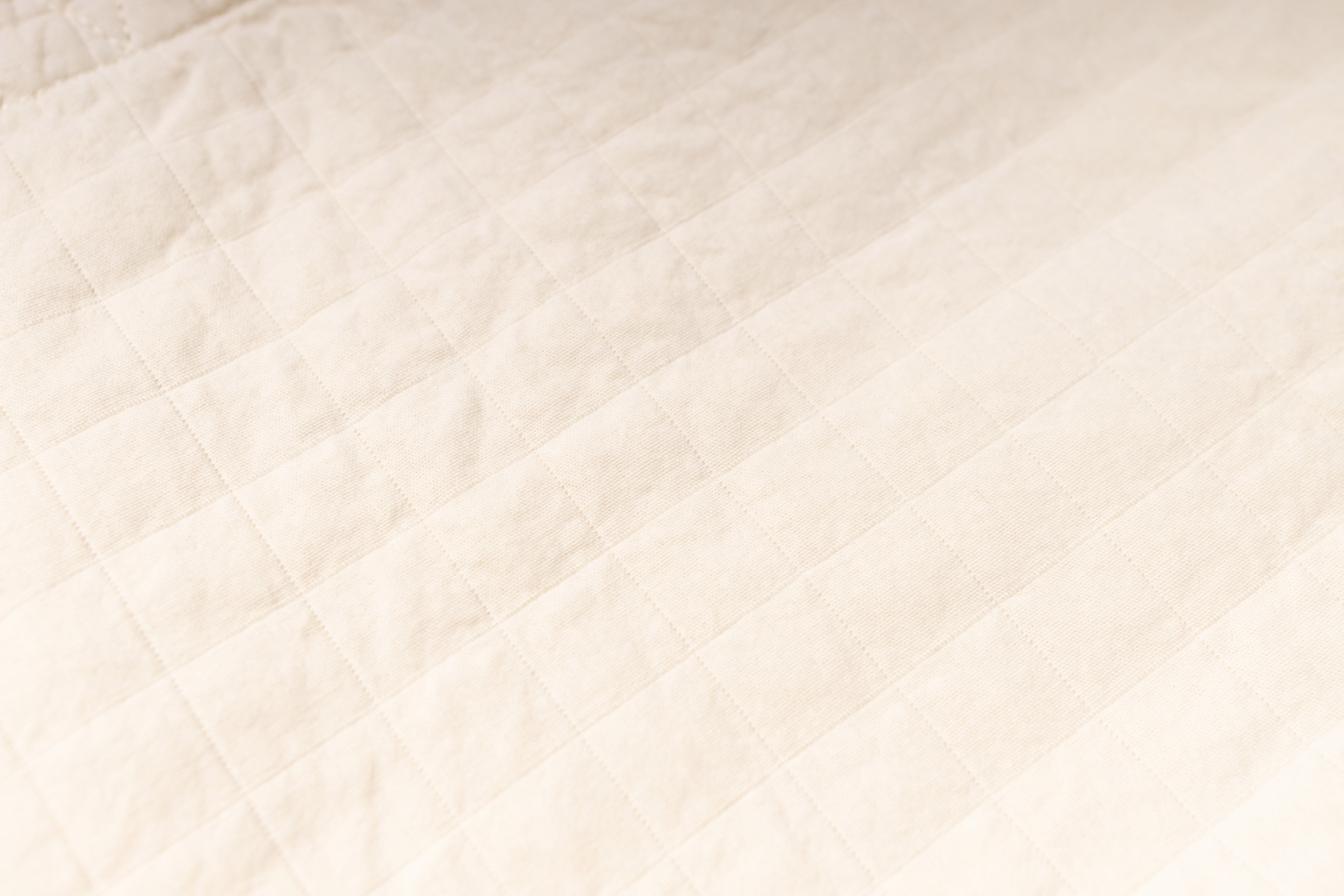 Close-up of a textured beige fabric surface