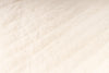 Close-up of a textured beige fabric surface