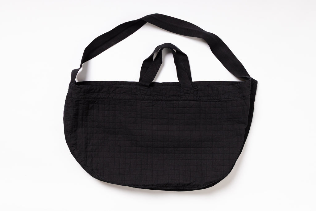 Black shoulder bag on a white background