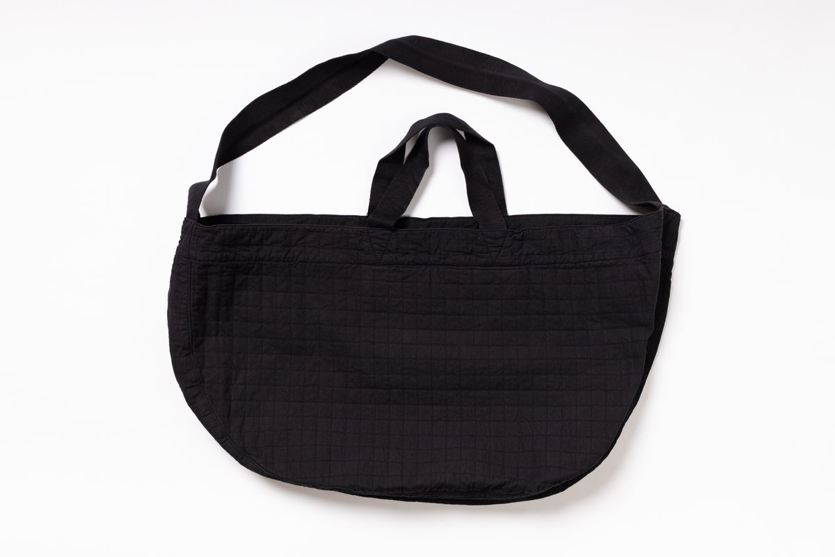 Black shoulder bag on a white background