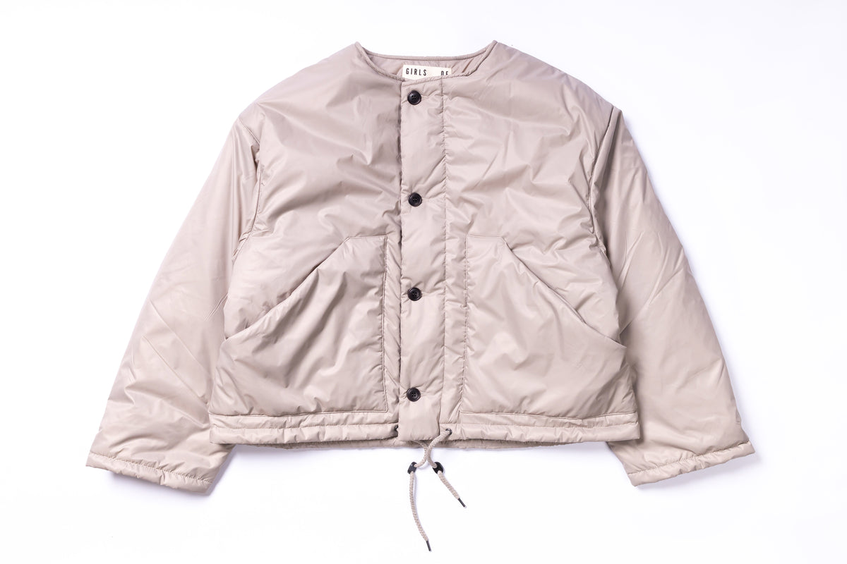 Beige puffer jacket on a white background