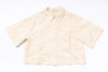 Beige textured shirt on a white background