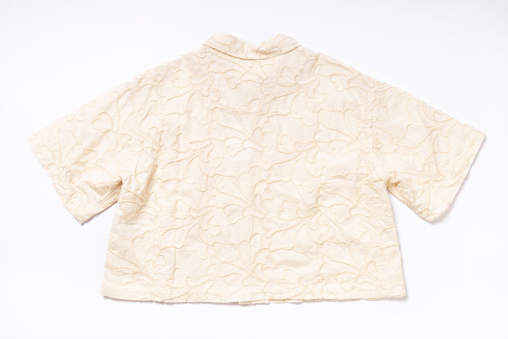 Beige textured shirt on a white background