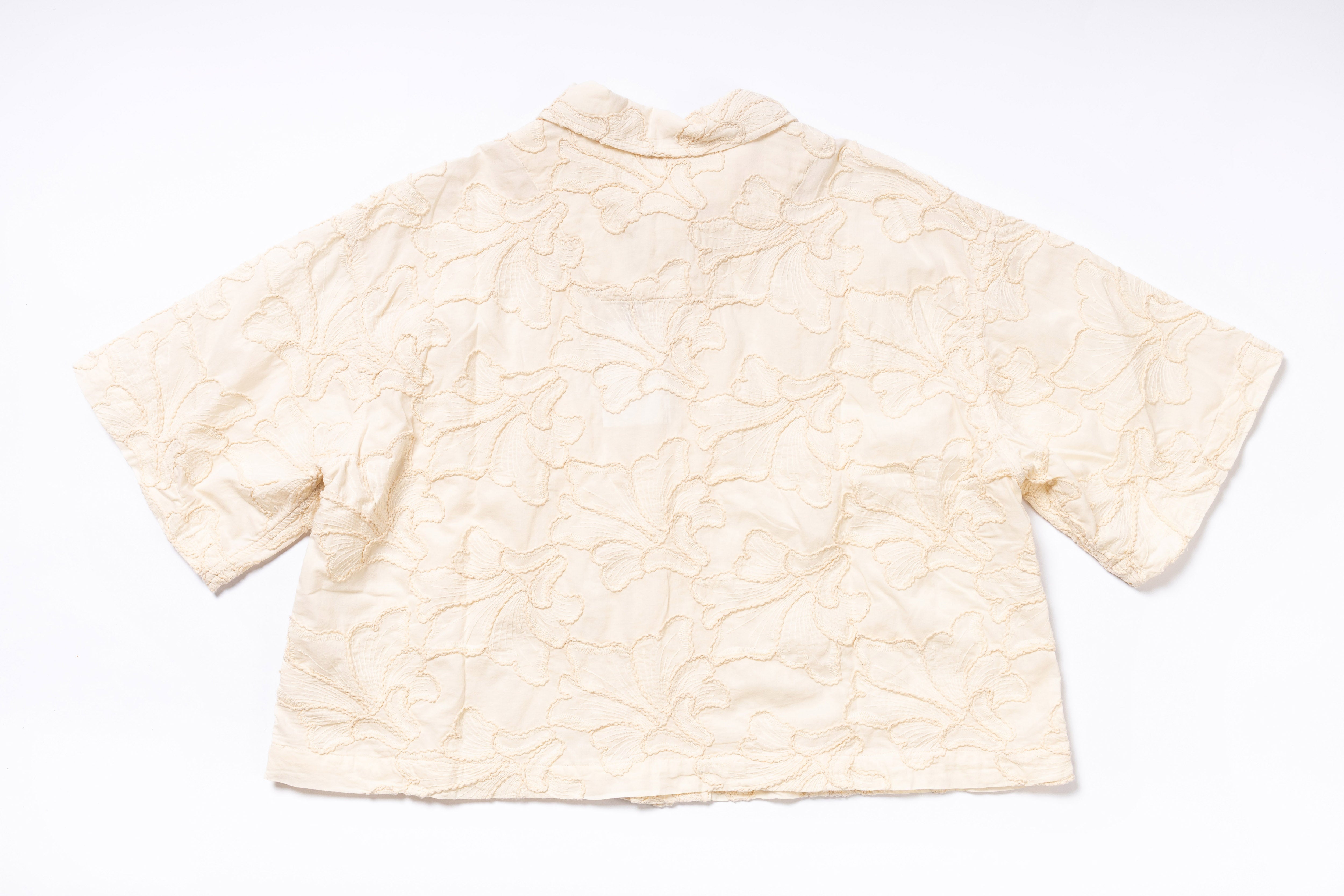 Beige textured shirt on a white background