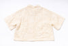 Beige textured shirt on a white background