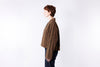 Person wearing a brown jacket on a white background
