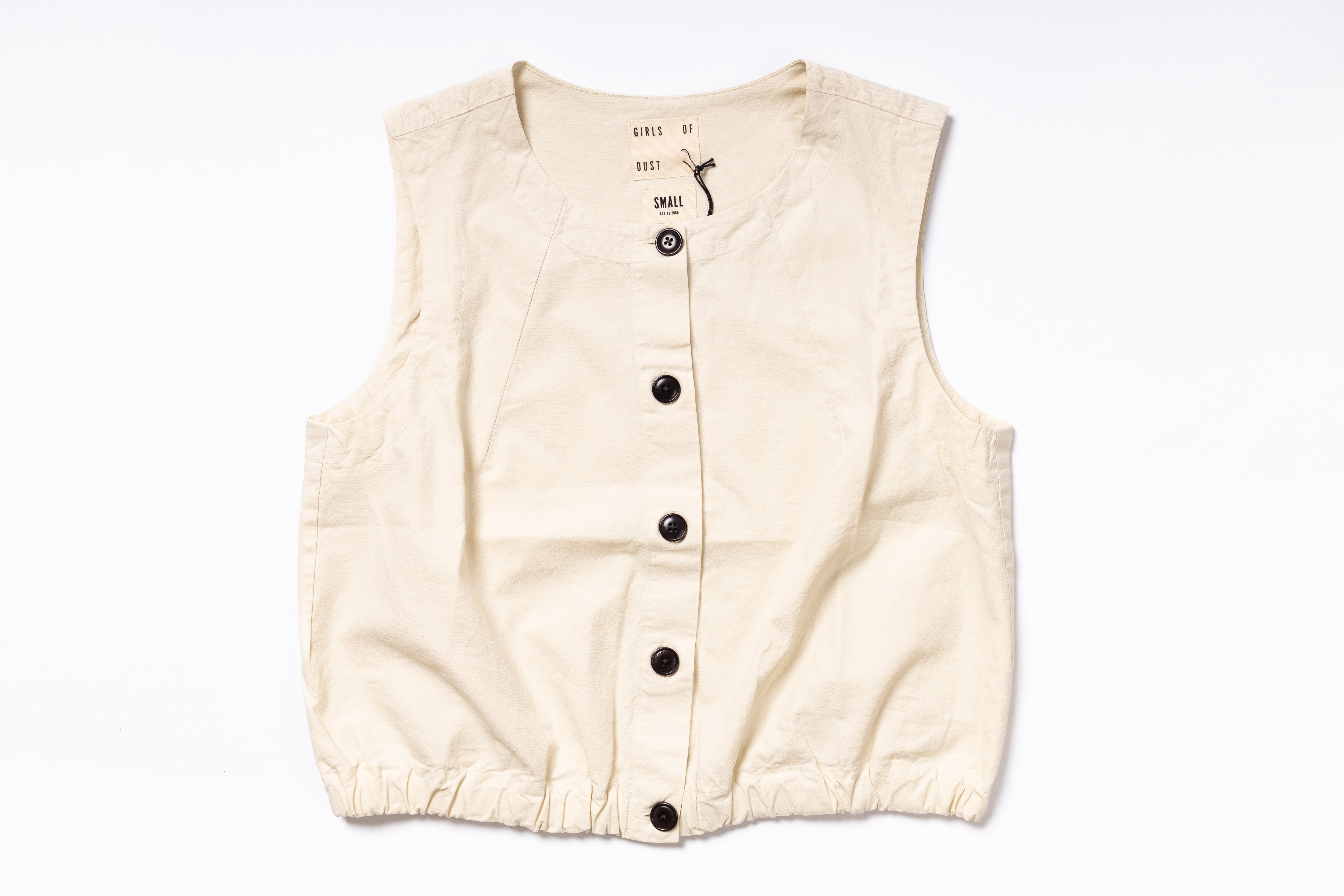 Beige vest with black buttons on a white background