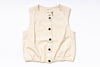 Beige vest with black buttons on a white background