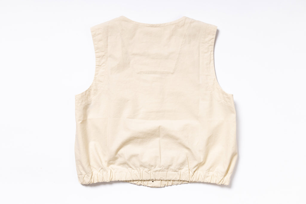 Beige sleeveless top on a white background