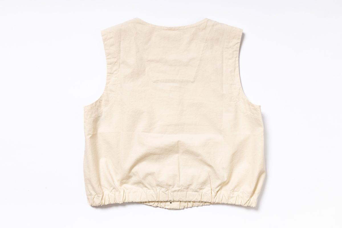Beige sleeveless top on a white background