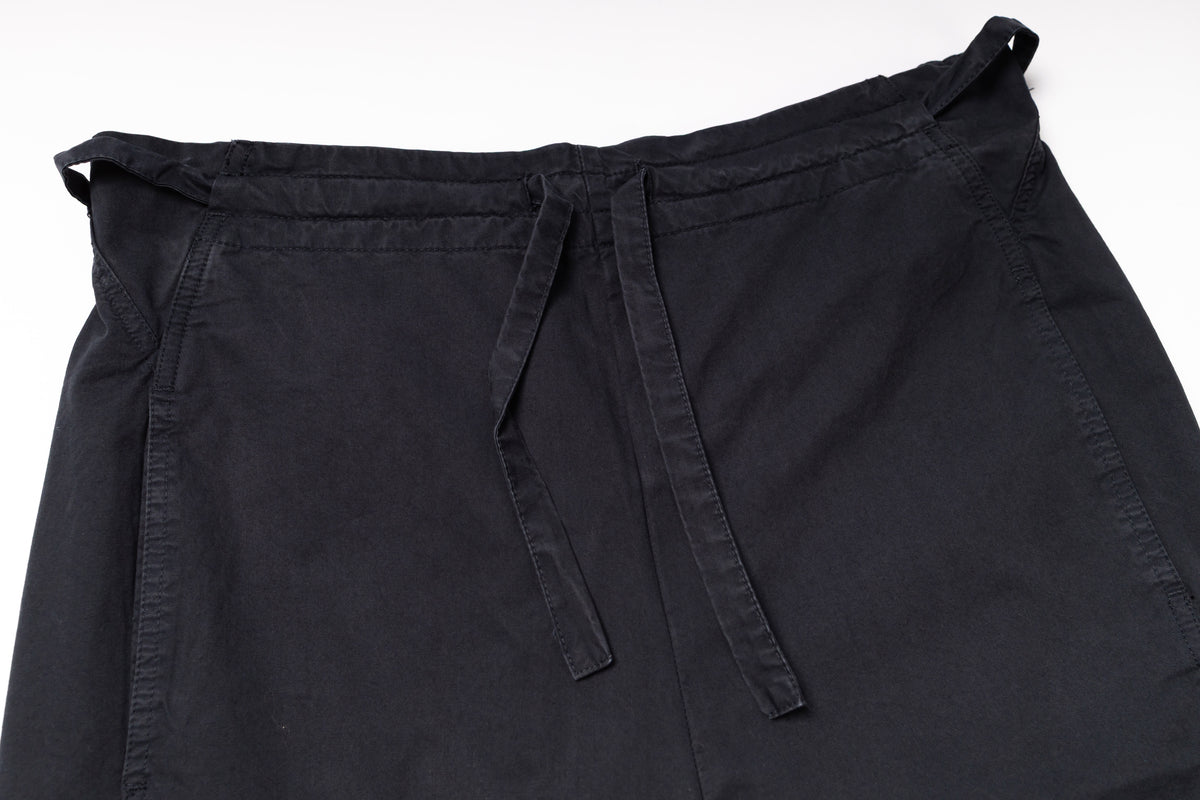 Black apron with a tie on a white background