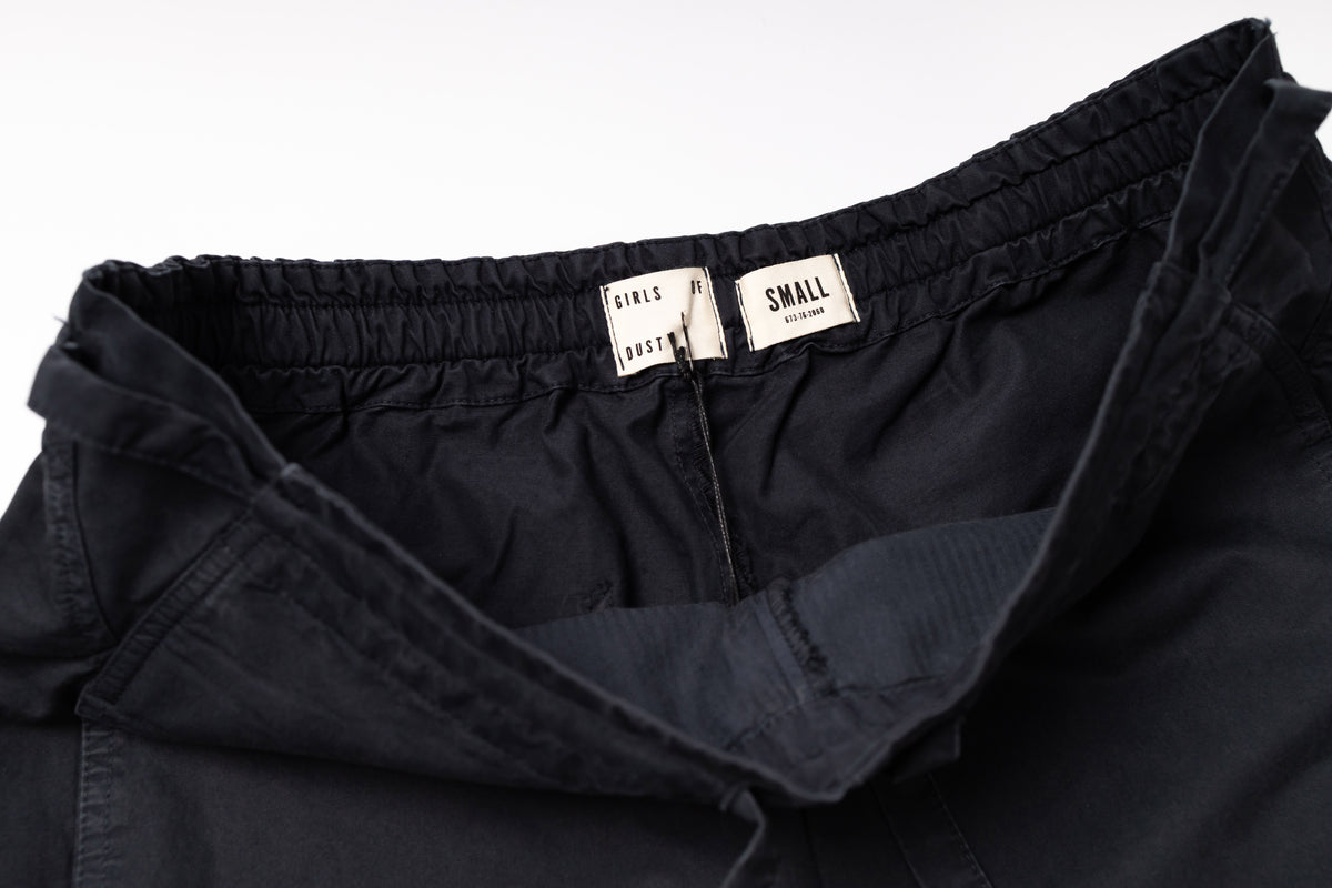 Black pants with size labels on a white background