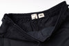 Black pants with size labels on a white background