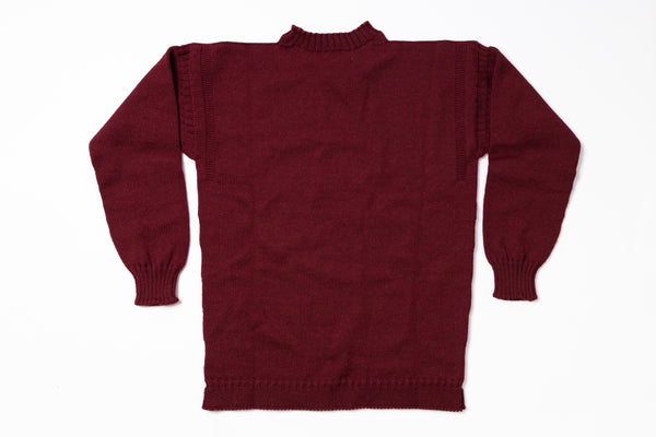 Maroon sweater on a white background