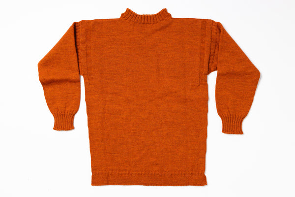 Orange sweater on a white background